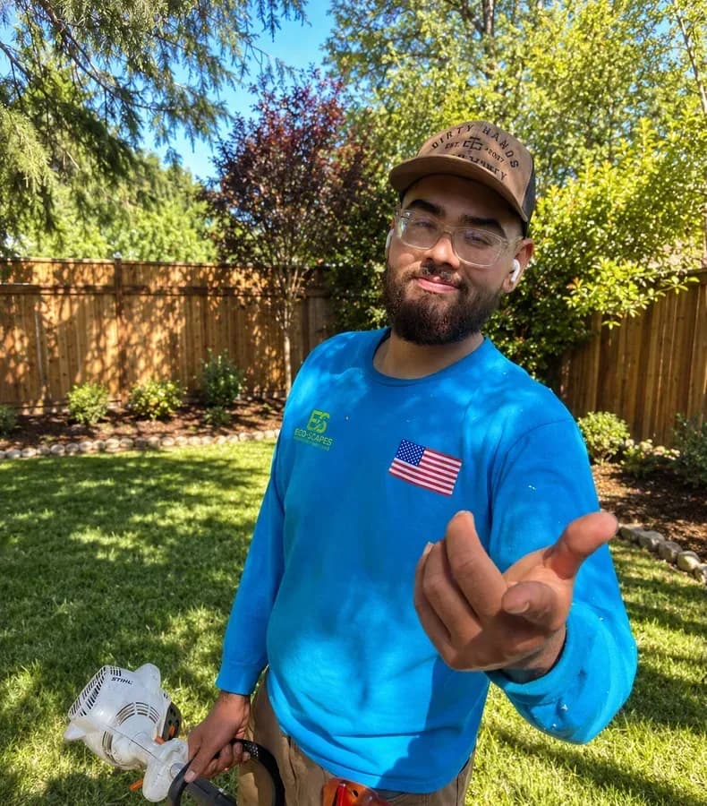 Eco Scapes Land Care owner Carlos working in a yard in Solano County California