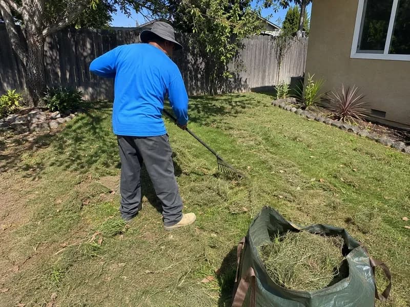 Eco Scapes crew member completing a residential landscape cleanup in California
